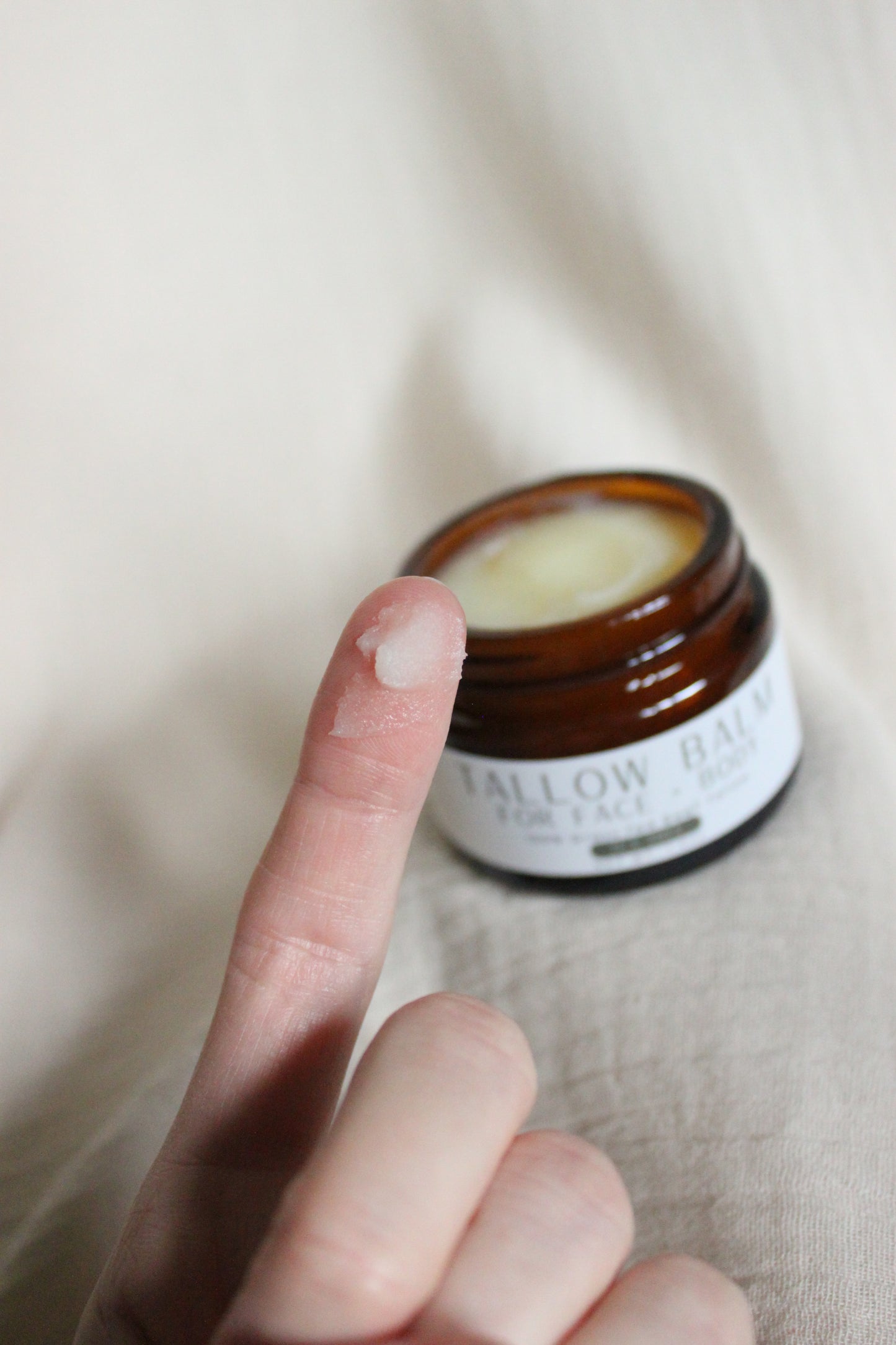 100% Grass-fed Beef Tallow Face + Body Balm containing organic jojoba oil and tea tree essential oil