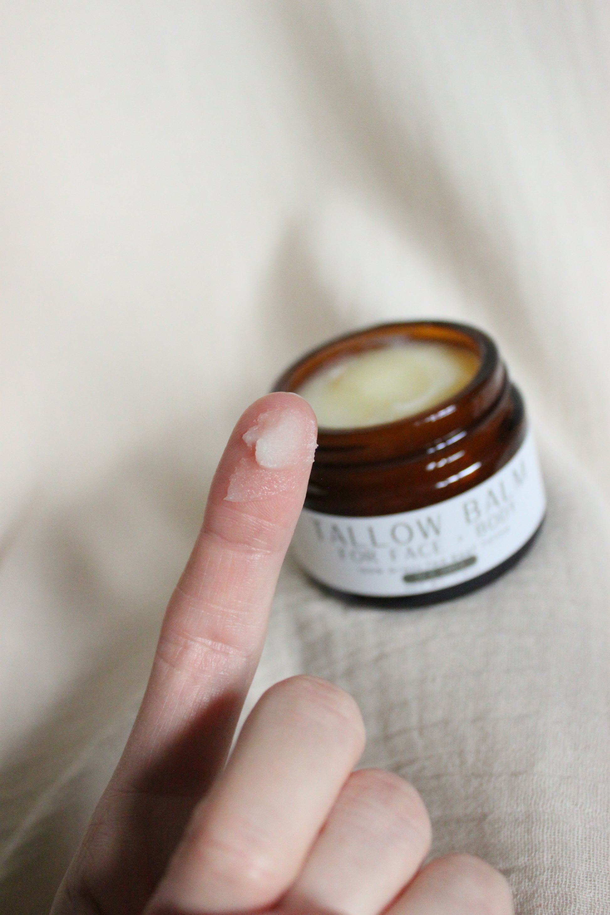 100% Grass-fed Beef Tallow Face + Body Balm containing organic jojoba oil and tea tree essential oil